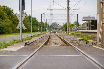 Fototapeta na wymiar Close up view of empty railway track near platform train station in countryside area in Germany.