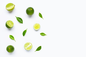 Limes with leaves isolated on white background.