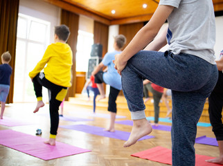 Yoga training on mats, young people are training yoga