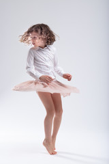 Cute little barefoot girl doing a pirouette © Giulio_Fornasar