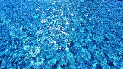 bright blue water in swimming pool