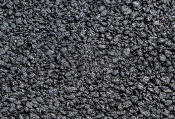 Black street asphalt with rough surface as background