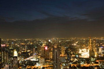 Fototapeta na wymiar light bokeh city landscape at night sky with many stars, blurred background concept.