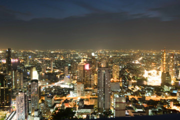 Fototapeta na wymiar light bokeh city landscape at night sky with many stars, blurred background concept.