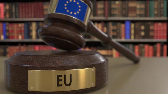 Flag of the European Union on falling judges gavel in court. National justice or jurisdiction related conceptual 3D animation