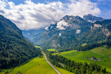 Wonderful aerial view over a valley in the Swiss Alps - Switzerland from above