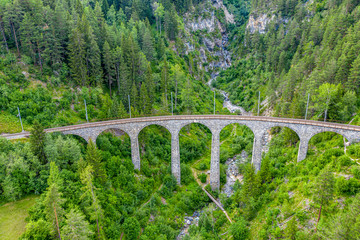 Fototapeta na wymiar Famous viaduct near Filisur in the Swiss Alps called Landwasser Viaduct - Switzerland from above