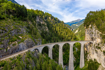 Famous viaduct near Filisur in the Swiss Alps called Landwasser Viaduct - Switzerland from above