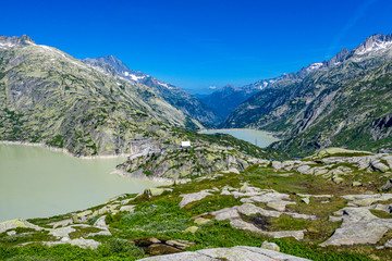 Aerial view over a mountain lake at Grimsel pass in Switzerland