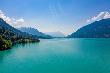 Obraz premium The turquoise water of a wonderful lake in Switzerland - aerial view