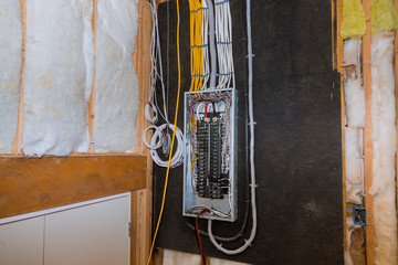 Wired electrical terminals on metal bar wiring cable box, residential house under construction