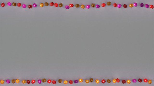 Frame of colorful rotang string lights and free space. Abstract holiday template. Seamless loop 3D render animation