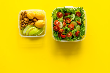 meal in lunch box to take away on yellow background top view mockup