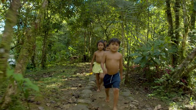 Kids Playing And Sailing By The River And Running Around Amazonian Village In Ecuador