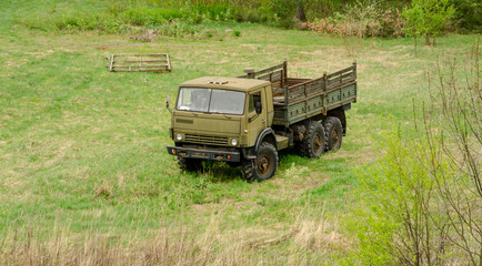 Military truck, on grass field