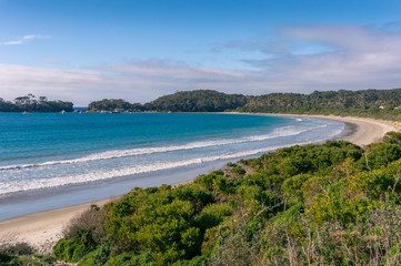 Picturesque bay with sandy beach on sunny day