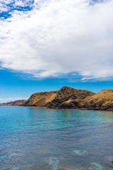 Fototapeta na wymiar Mountain coastline with deep blue ocean water landscape
