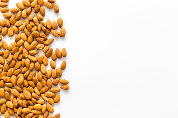 Almond on white background top view space for text