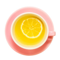 pink cup of tea with a single piece of lemon, on a white background