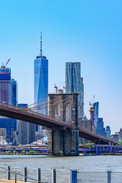 Brooklyn Bridge with lower Manhattan skyline, One World Trade Center in New York City.