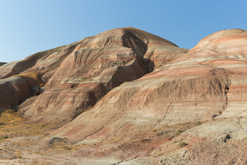 Fototapeta premium Rainbow hills of Khizi, landscape red mountains. Xizi, Azerbaijan.