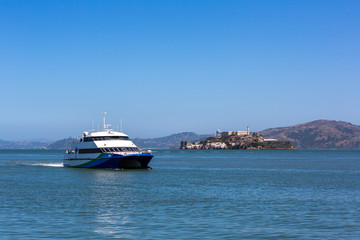 Tourist ship and Alcatraz Island in San Francisco, USA.