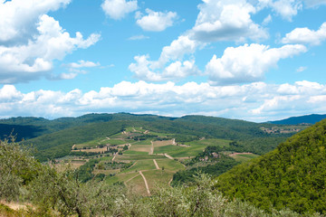 Fototapeta na wymiar Italian field and mountains with blue sky