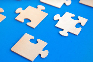 Puzzle pieces on a blue background