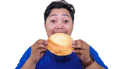 fat or overweight Asian man eating a lot of big unhealthy and sweet food on the plate isolated in white