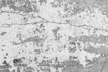 Obraz na płótnie Canvas Texture of a concrete wall with cracks and scratches which can be used as a background
