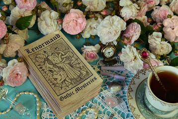 Still life with Lenormand tarot cards, roses and cup. - obrazy, fototapety, plakaty