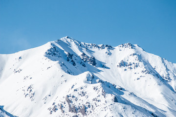 Fototapeta na wymiar mountains in winter, snow capped peaks, mountain winter landscape
