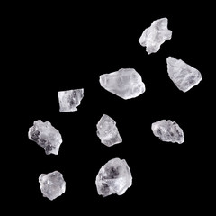 Crystals of salt isolated on black background.
