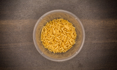 Top view of dried noodles as a Indian snack<