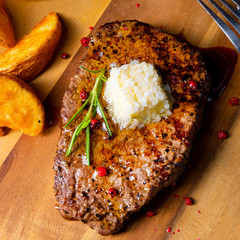 Butter Beef Steak with herbs and potato wedges