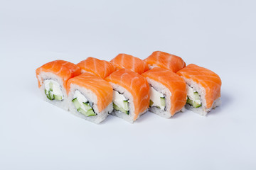 Japanese national popular cuisine. Sushi, rice and fish. Tasty, beautifully served food in a restaurant, cafe, with elements of the original design.