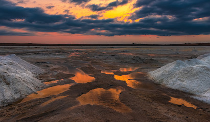 Salt mining on the lake during sunset