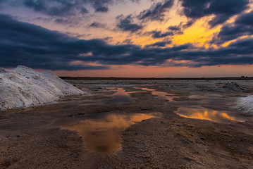 Salt mining on the lake during sunset