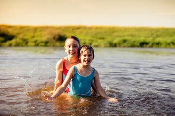 Children   swimming in   warm river.