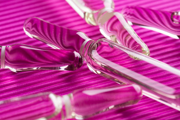 Scattered ampoules. Glass ampoules close up. Medical ampoules.