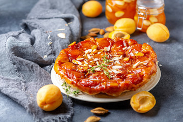 Homemade tarte tatin pie with apricots and thyme.