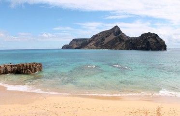 Porto Santo warm bright waters, near Islet of Cal, Calheta beach, at the SW most point of this calm Portuguese island. Cristiano Ronaldo planned to build a 5 stars resort here, not far from Madeira.