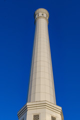 Minaret of the White Minor Mosque against the blue sky