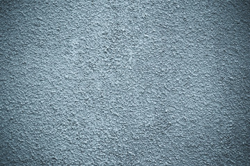 Dark rough concrete wall. Abstract gray pattern, architecture background. Black dirty stone texture. Grunge, blue stucco surface with vignette.