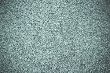 Gray and light green painted concrete wall, stucco textured. Modern grunge background. Decorative rough  pattern. Grunge surface with vignette. Dirty cement wall.