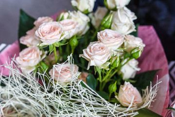 bright wedding bouquet of summer white pink roses  with wedding rings
