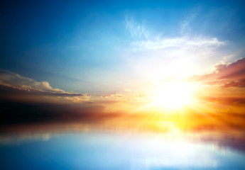 bright sunset over the sea, beautiful background with sun rays
