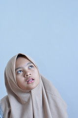 Portrait of a young muslim woman look at blank area for sign or copyspace