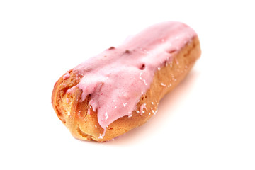 Traditional french dessert.Eclair with custard and icing on white background.