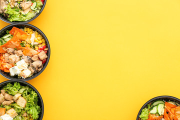 Many containers with delicious food on color background